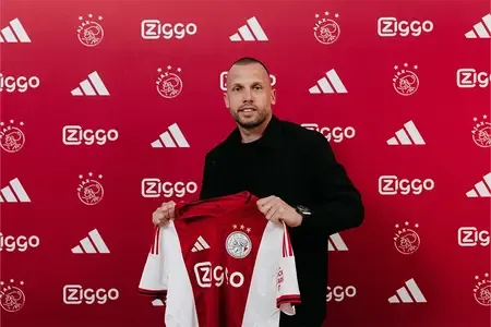 Football: Heitinga leaves Liverpool to sign in as Ajax's head coach