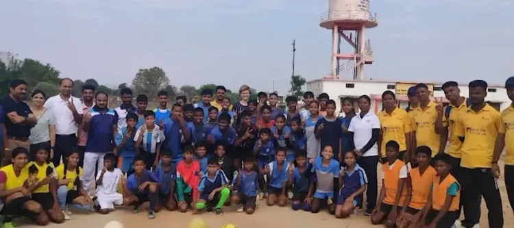 How did football players from a village in MP capture a German coach's interest?