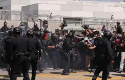 Why was a curfew implemented in downtown LA after protests and looting?